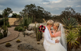 Portrait of two brides in a cactus garden