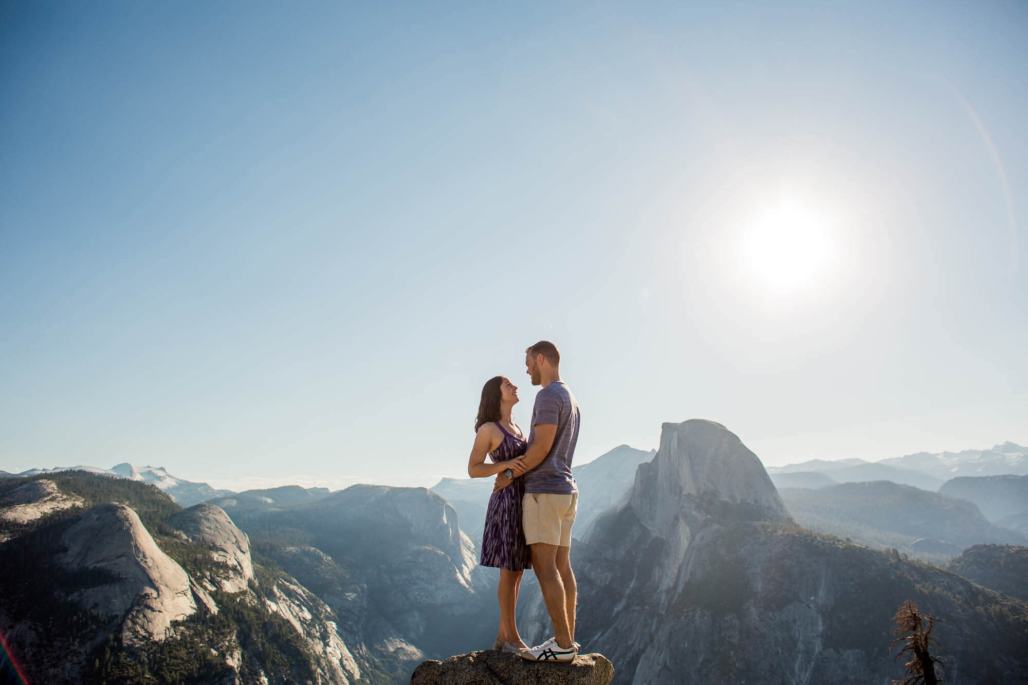 Portrait of a couple at Glacier Point with Half Dome in the background