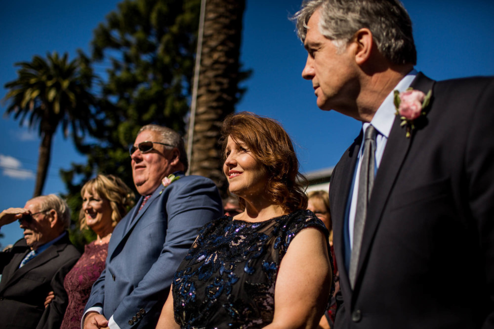 Parents look on as their children get married at the Winchester Mystery House in San Jose, CA