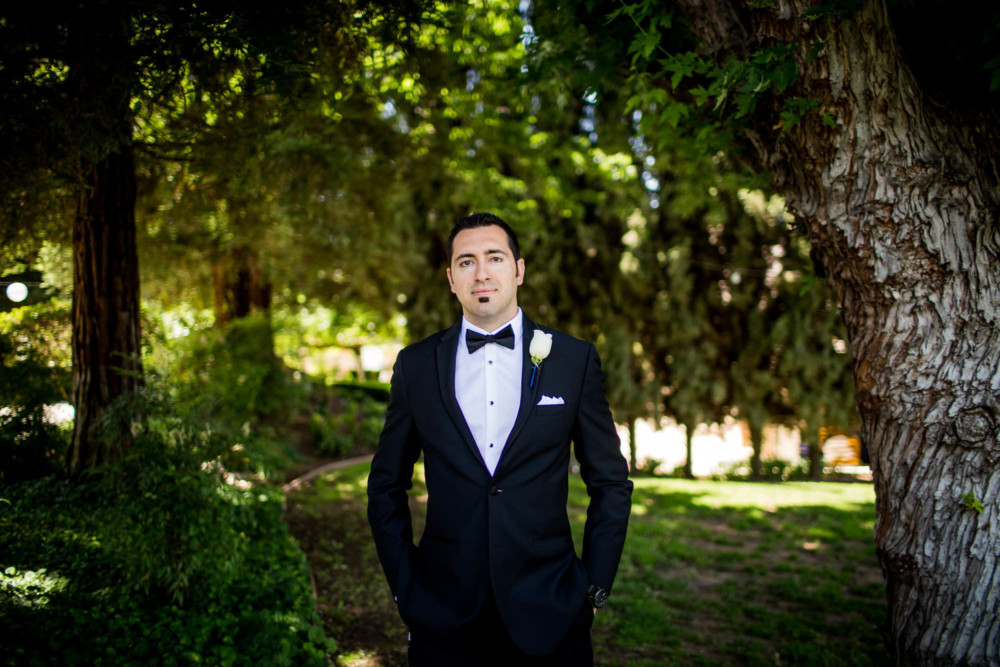 Serious groom portrait at Wolf Lakes Park in Sanger, CA