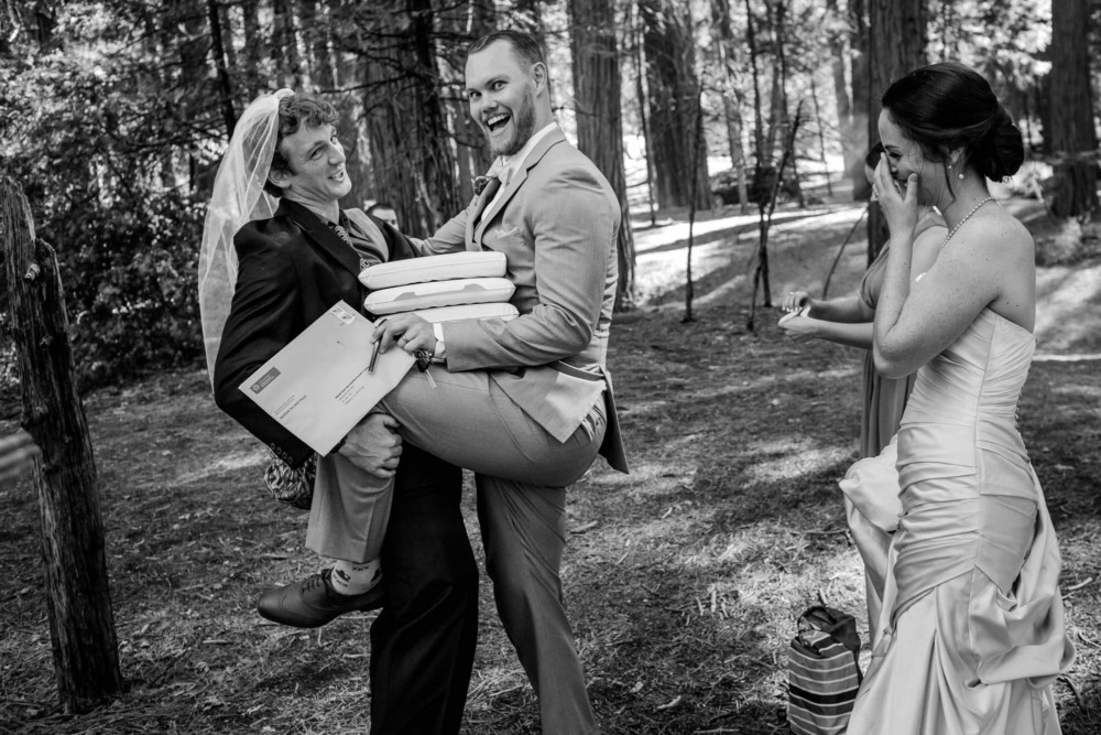 Goofy antics between the groom and a guest after the wedding in Yosemite Valley