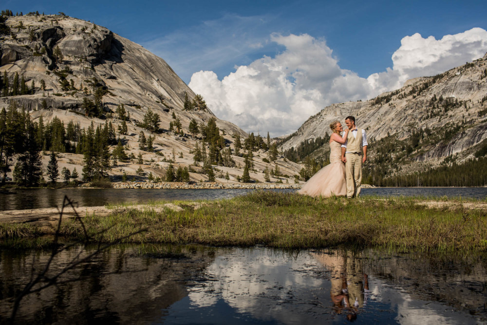 Portrait of a Bride and Groom at Tenaya Lake after their wedding in Tuolumne Meadows in Yosemite National Park