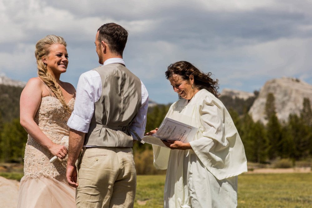 A bride laughs as the couple elopes in Tuolumne Meadows in Yosemite National Park