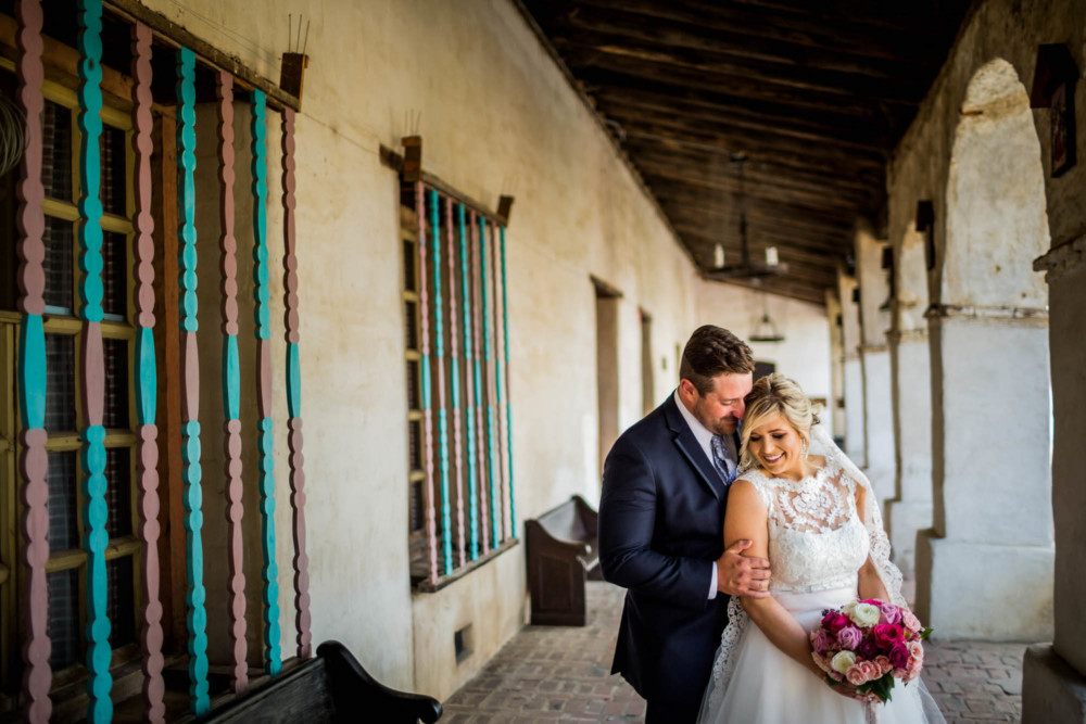 Portrait of a bride and groom at Mission San Miguel in Paso Robles, CA