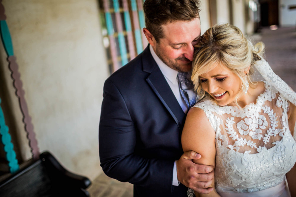Portrait of the bride and groom at Mission San Miguel in Paso Robles, CA