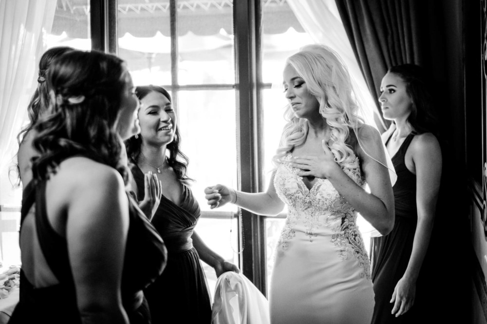 Bride has an emotional moment before her wedding at Copper River Country Club