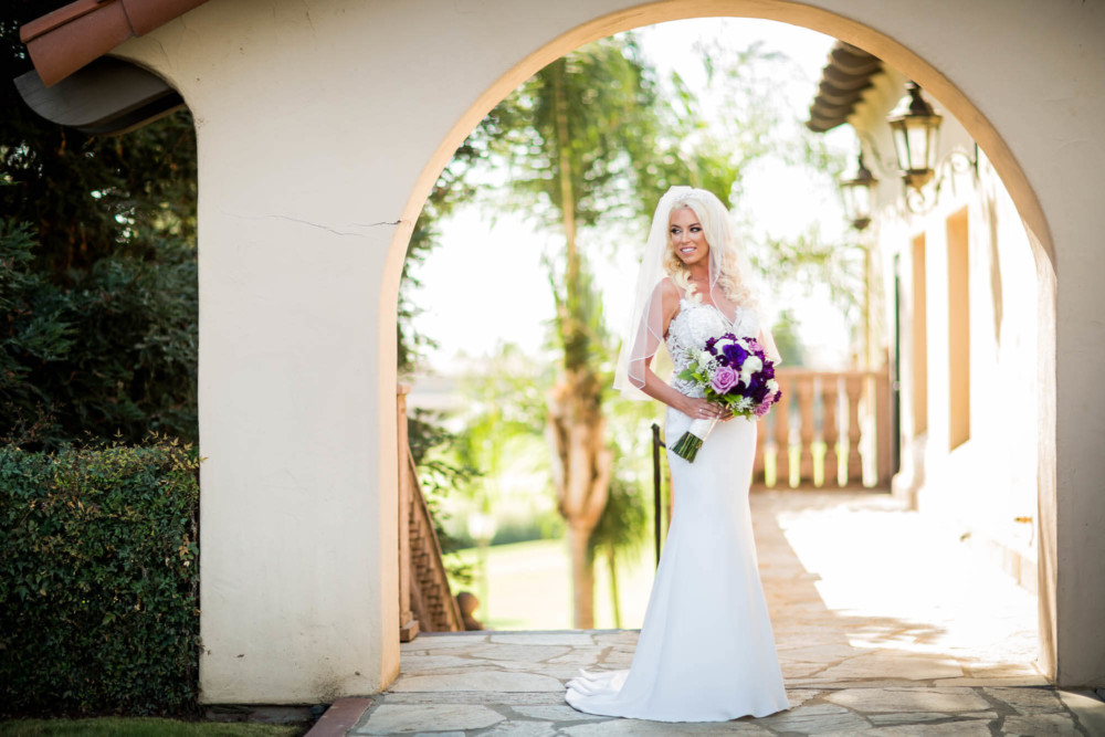 Bride's portrait under the arch at Copper River Country Club