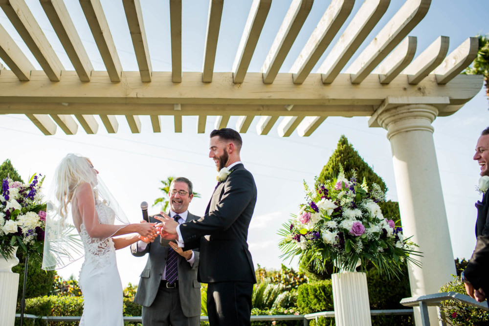Bride and groom share a laugh during their wedding at Copper River Country Club