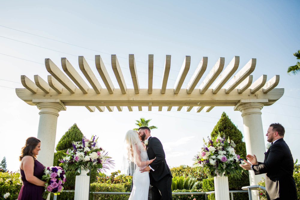 Bride and Groom's first kiss after their wedding at Copper River Country Club