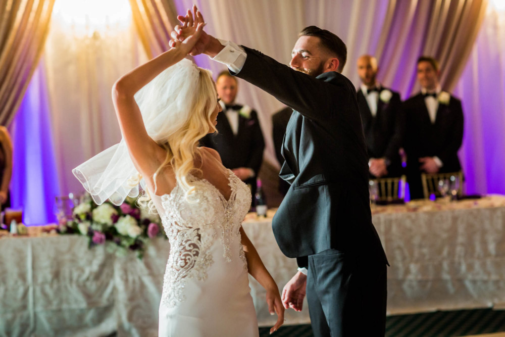 Bride and grooms first dance in the ballroom after their wedding at copper river country club