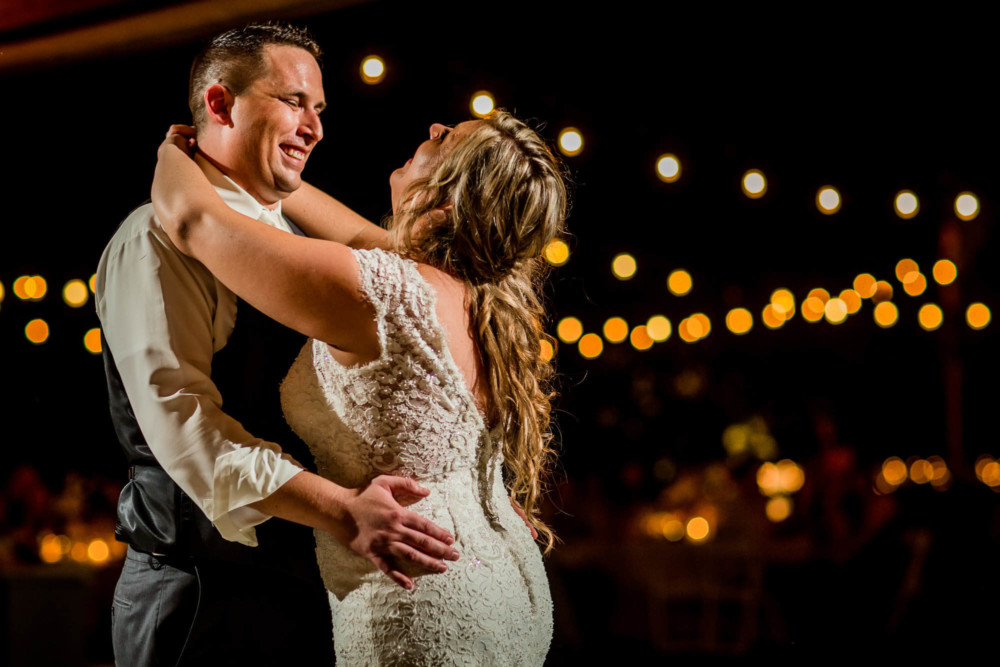 Bride and Groom laugh during their first dance.