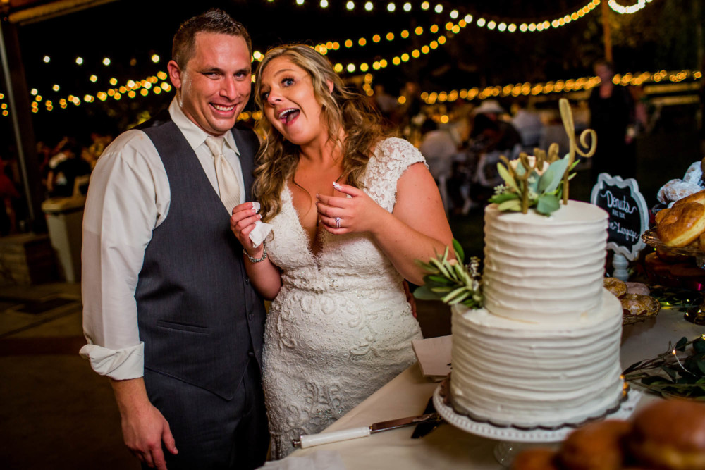 Couple laughing during their cake cutting