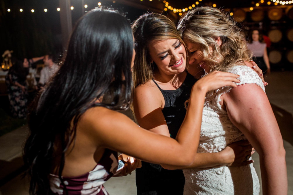 Emotional moment between the bride and her friends