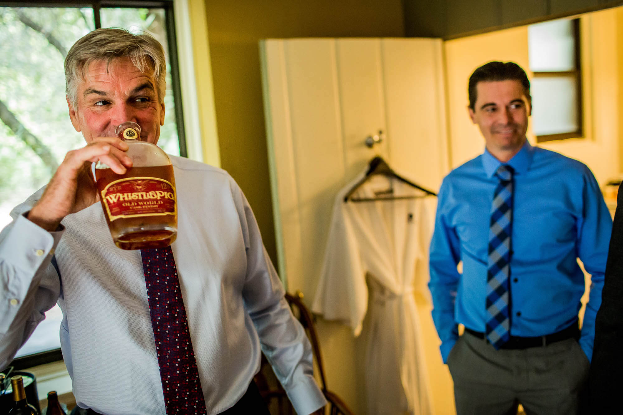 Father of the groom takes a sniff of Whistle Pig Rye whiskey