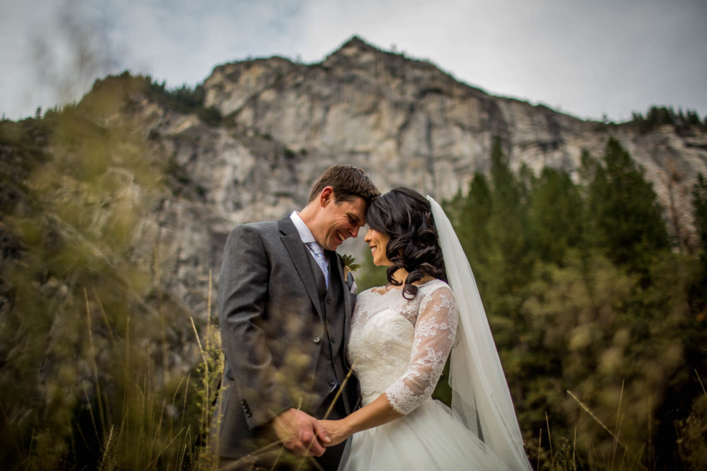 Portrait of a bride and groom in front of Royal Arches in Yosemite National Park