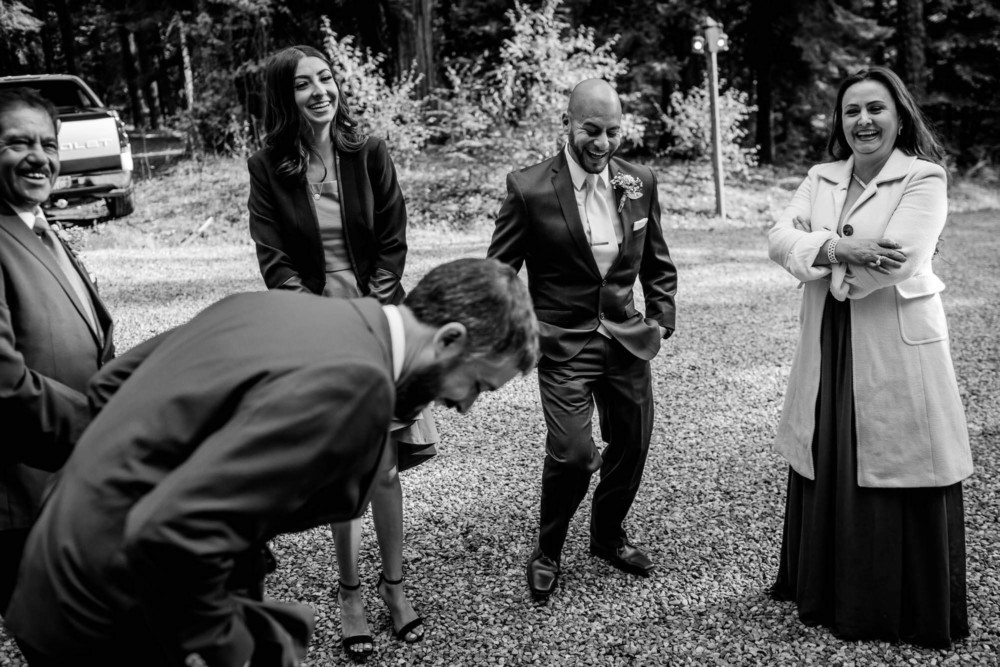 Groom and guests share a funny moment