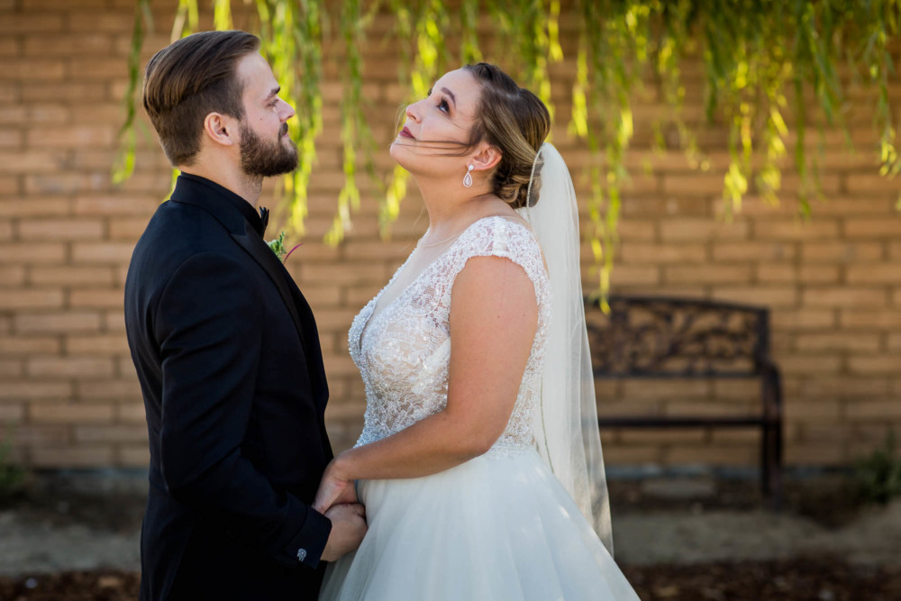 Bride holds back tears during the first look