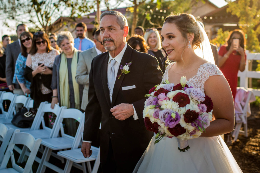 Bride and her dad walk down the aisle