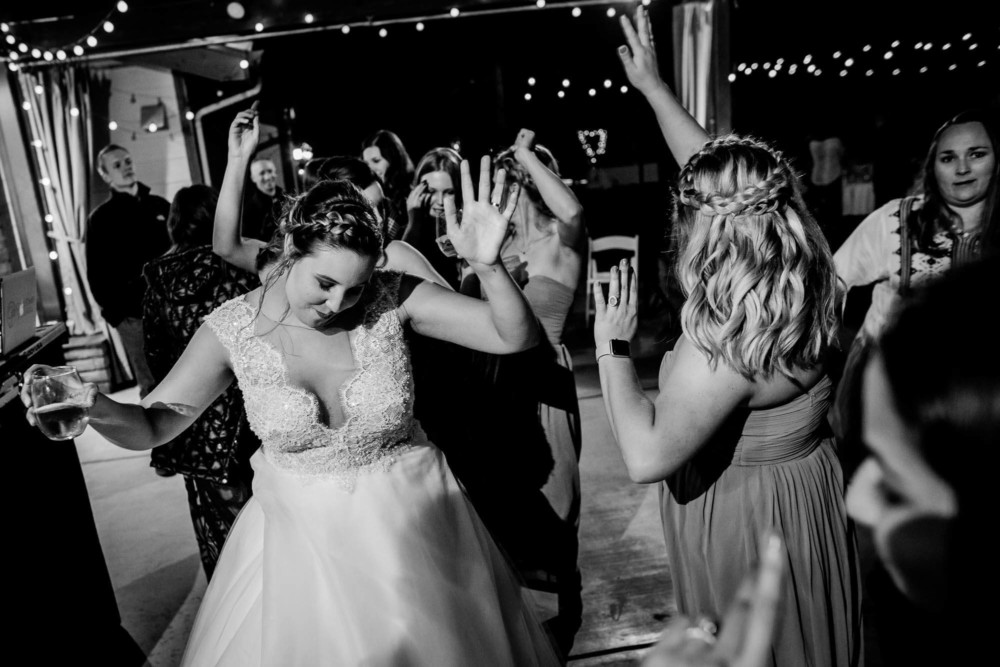 Bride dancing with guests during a wedding reception