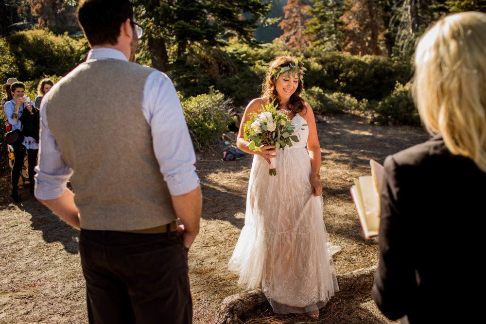 Bride walks down the aisle during her Glacier Point wedding