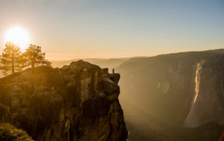 Viral portrait of bride and groom at Taft Point at sunset in Yosemite National Park