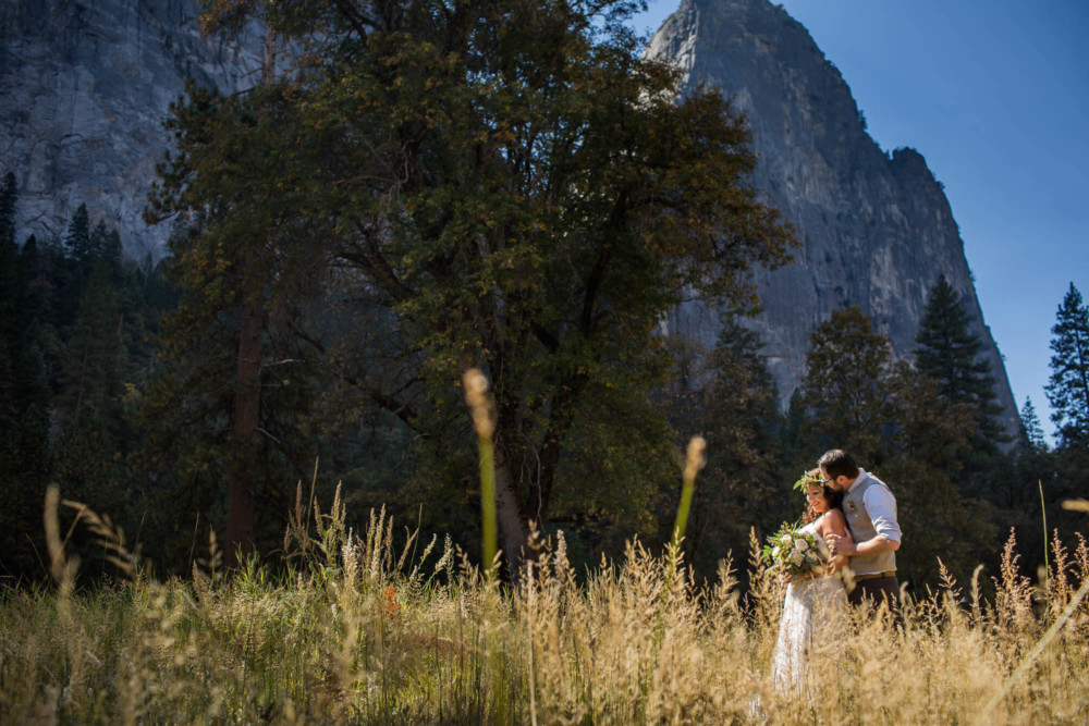 Portrait of a bride and groom in El Capitan Meadow