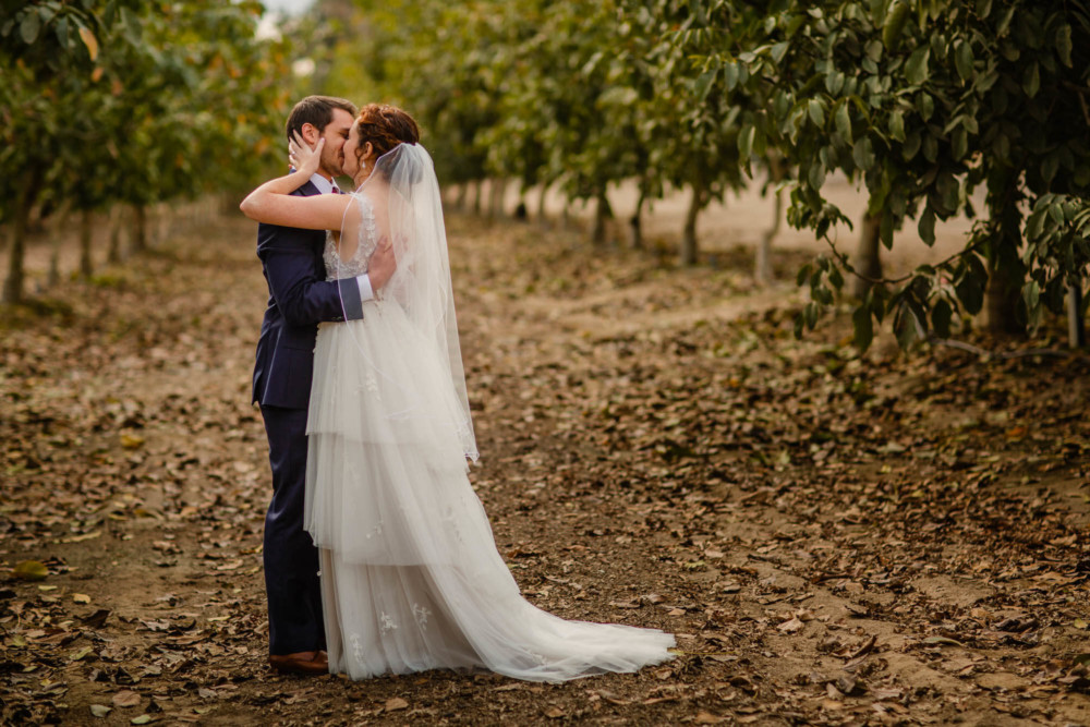 Bride and groom kiss during their first look