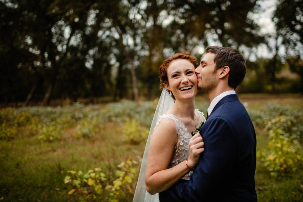 Portrait of bride and groom in a meadow
