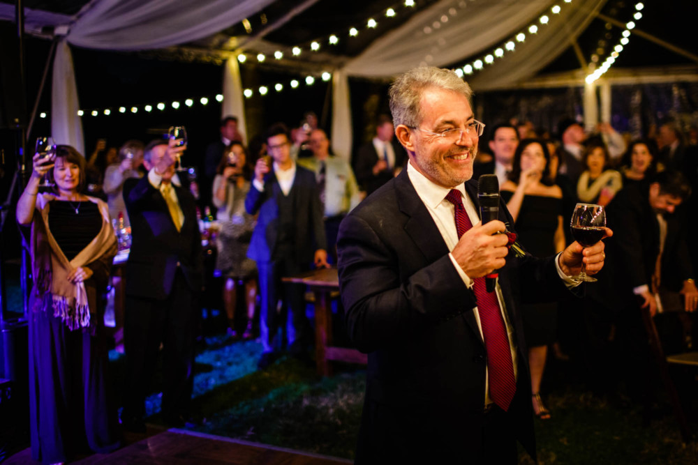 Father of the bride toasting the bride and groom
