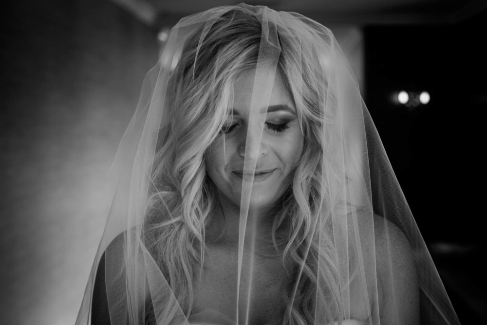 Bride takes a moment with her eyes closed before walking down the aisle