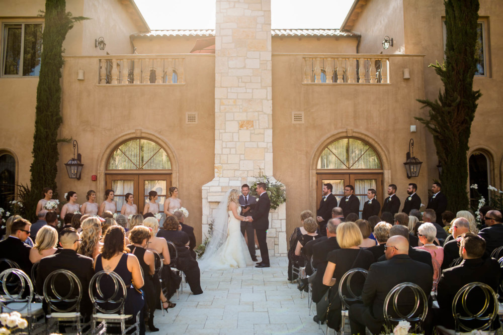 Wide shot of the wedding ceremony area and guests at the Allegretto Vineyard Resort