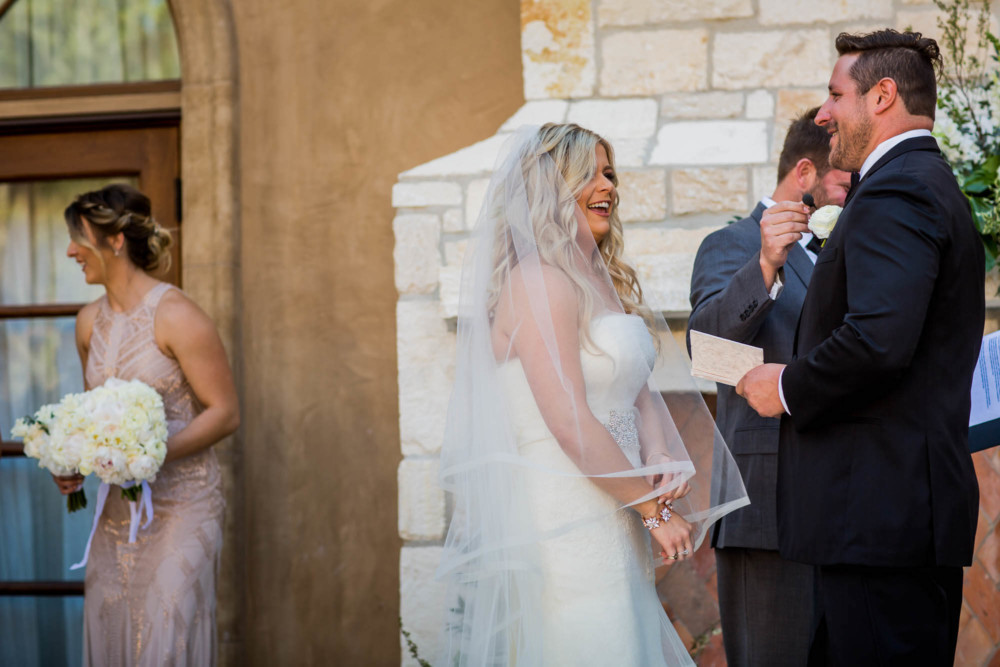 Bride reacts with laughter during the ceremony