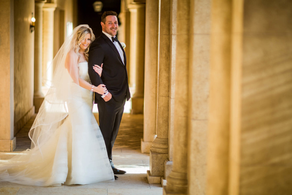 Portrait of the bride and groom among the pillars at the Allegretto Resort in Paso Robles, CA
