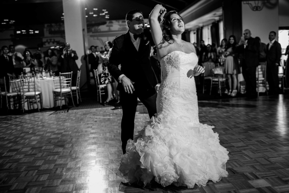 Groom spins bride during their first dance kicking off their reception at Copper River Country Club