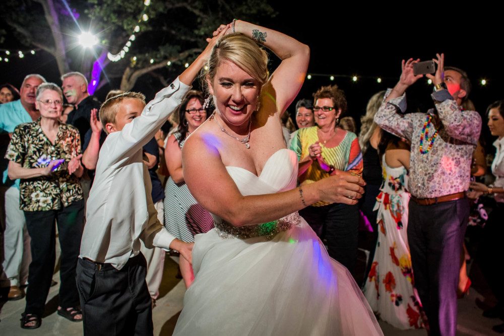 Bride dances with her son during the wedding reception