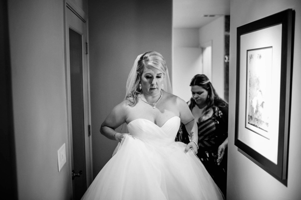 Bride walks down a hallway