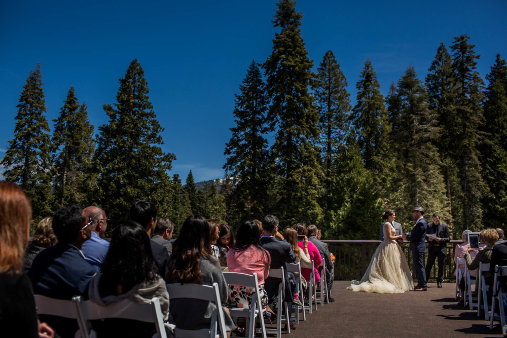 Wide view of a wedding on the deck at the Tenaya Lodge