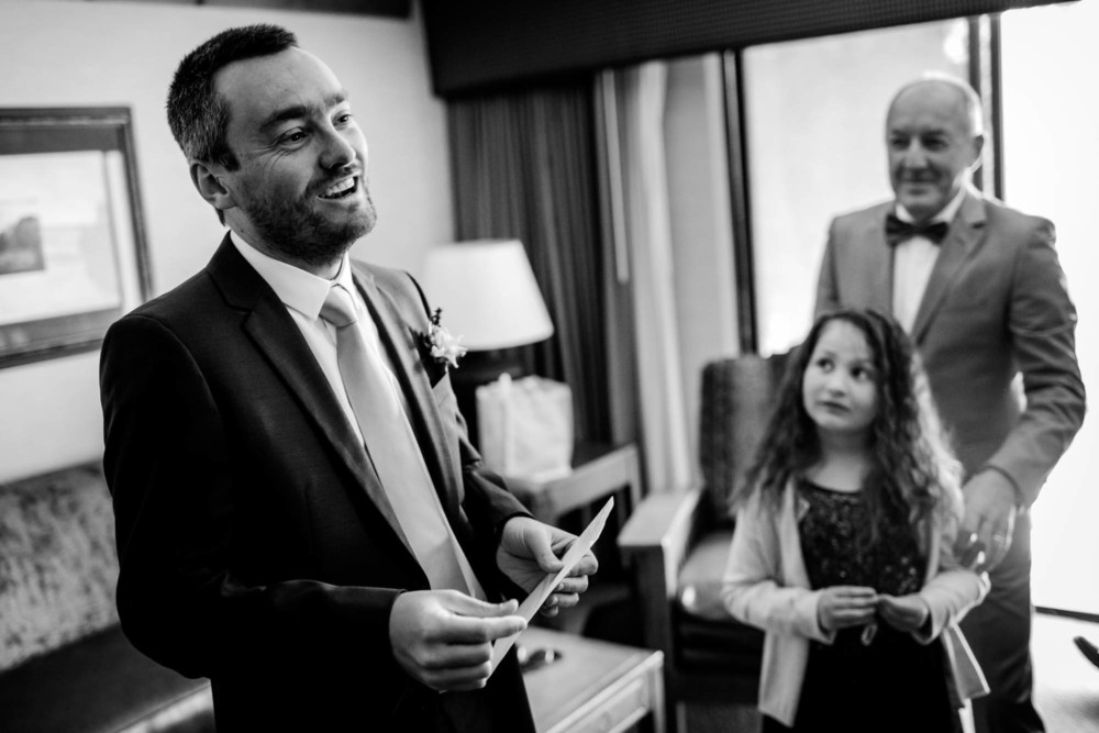 Groom gets emotional reading a card before his wedding