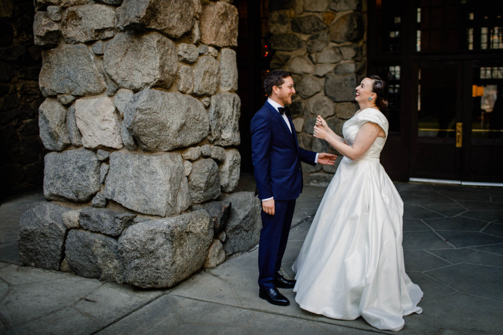 Bride and groom share a funny moment during their first look