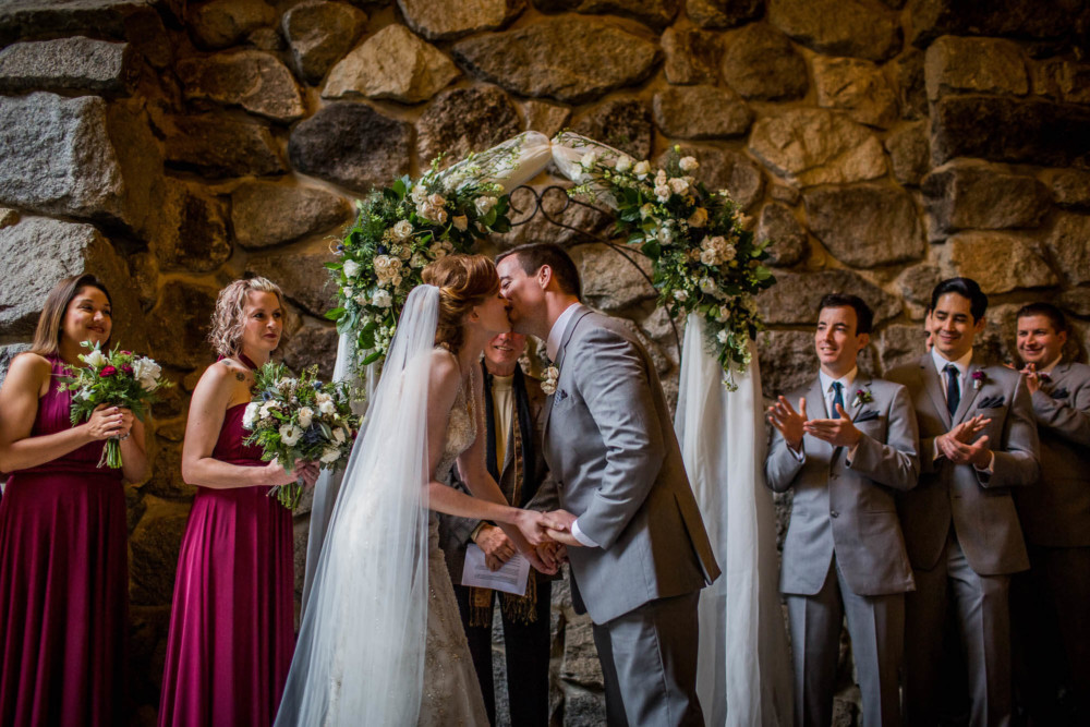Bride and groom's first kiss after their ceremony at The Majestic Yosemite Hotel