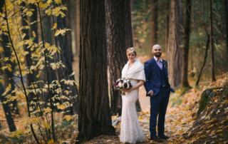 Bride and groom in the forest in Yosemite National Park