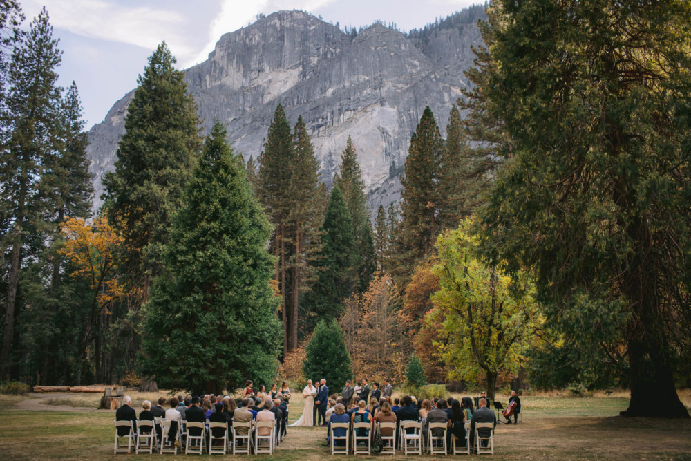 Wedding ceremony on the lawn at the Majestic Yosemite below Glacier Point