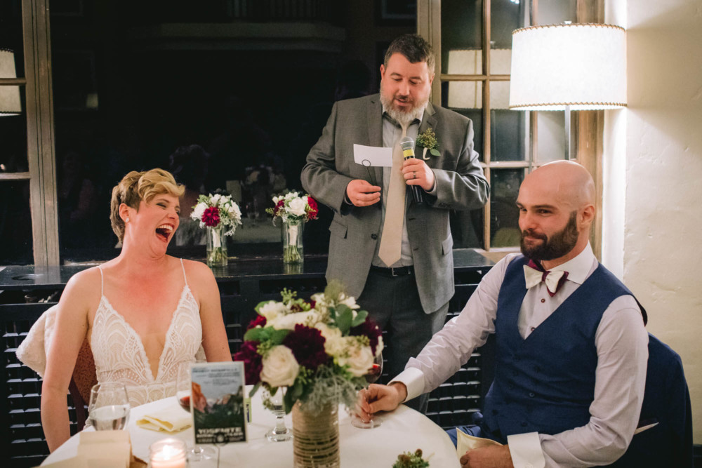 Bride and groom react to the best man's speech at the Majestic Yosemite reception