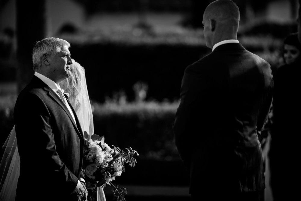 Bride and her father at the head of the aisle before giving her away to the groom