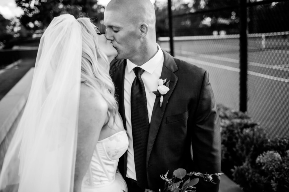 Bride and groom share a kiss after their ceremony