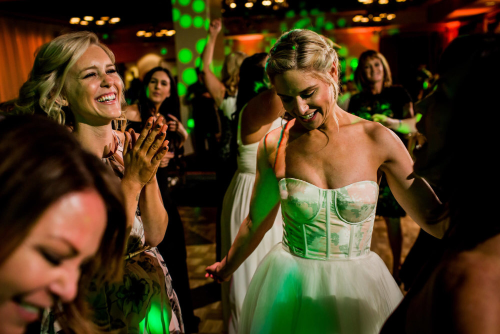 Bride and guests dance at the wedding reception