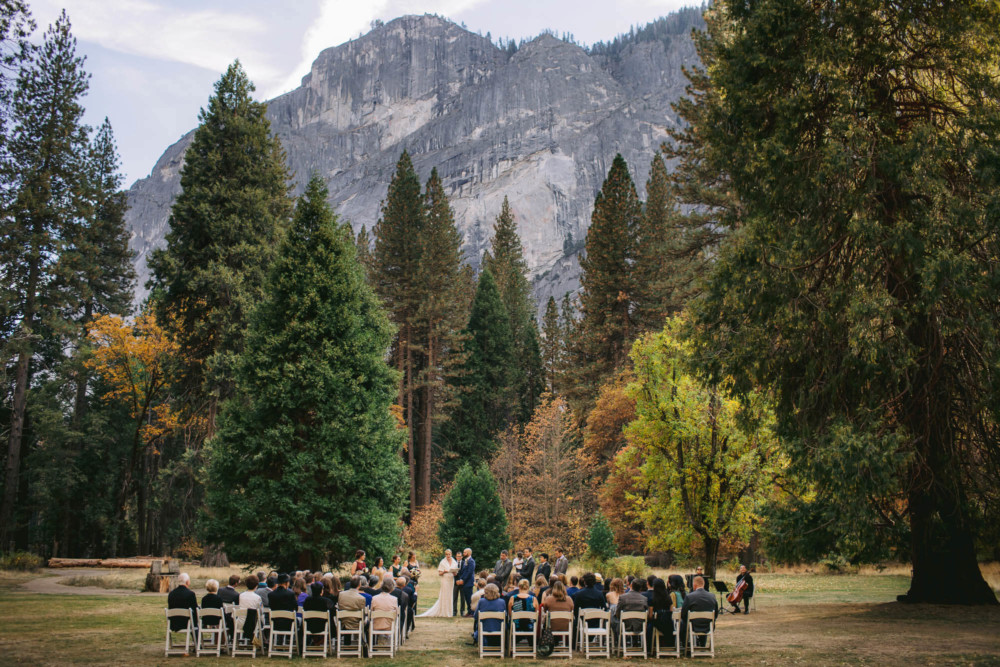 Wedding ceremony on the Majestic Yosemite Hotel wedding lawn under Glacier Point