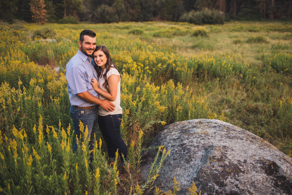 Bride and groom pose for a portrait in a mountain meadow near Shaver Lake, CA
