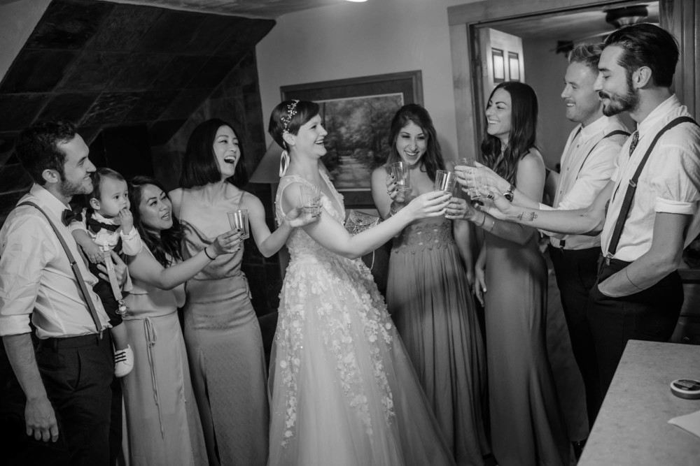Bride and Bridesmaids toasting with champagne