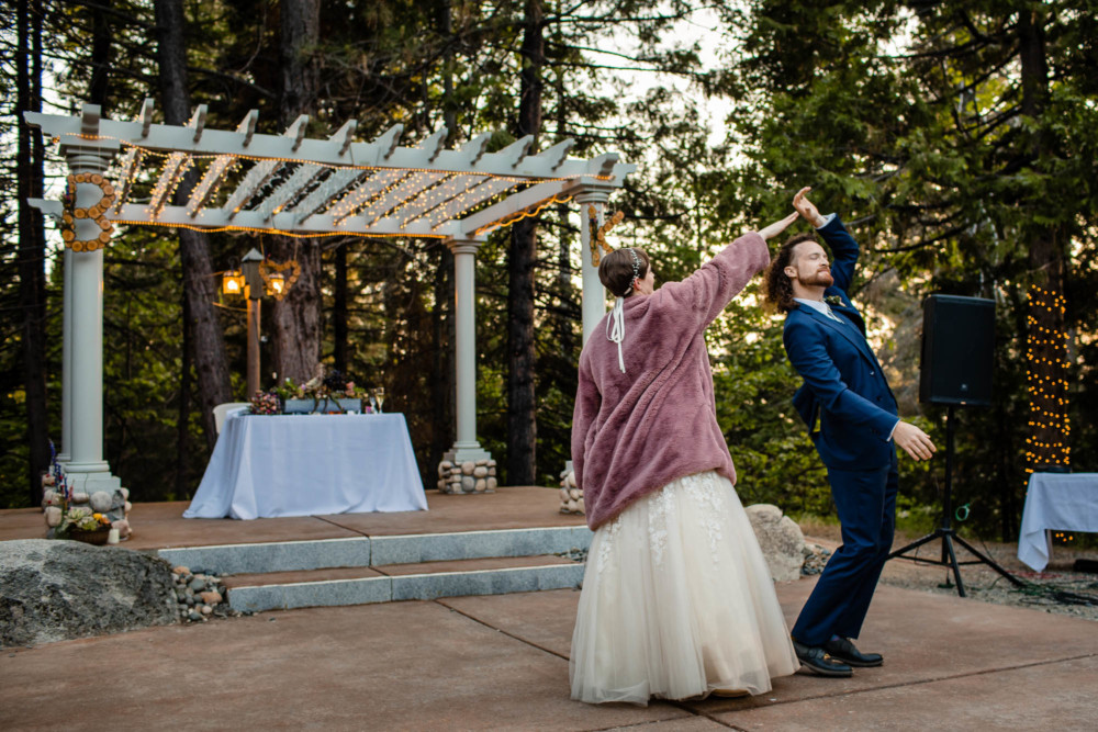 Bride twirls the groom during their first dance at Paradise Springs